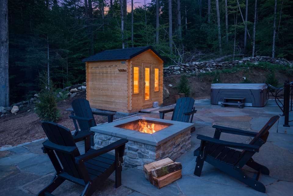 Warm up by the fire pit after a soak in the hot tub, with a private sauna just steps away for the ultimate reset.