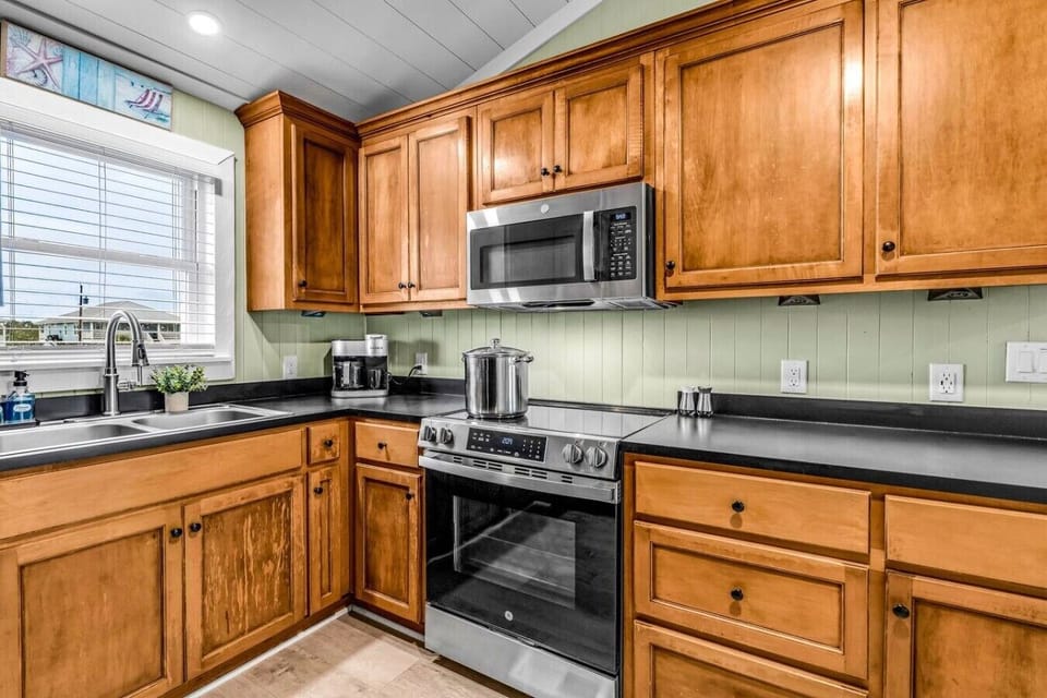 Whip up feasts for the whole group on a full-size stainless range with room to spare.