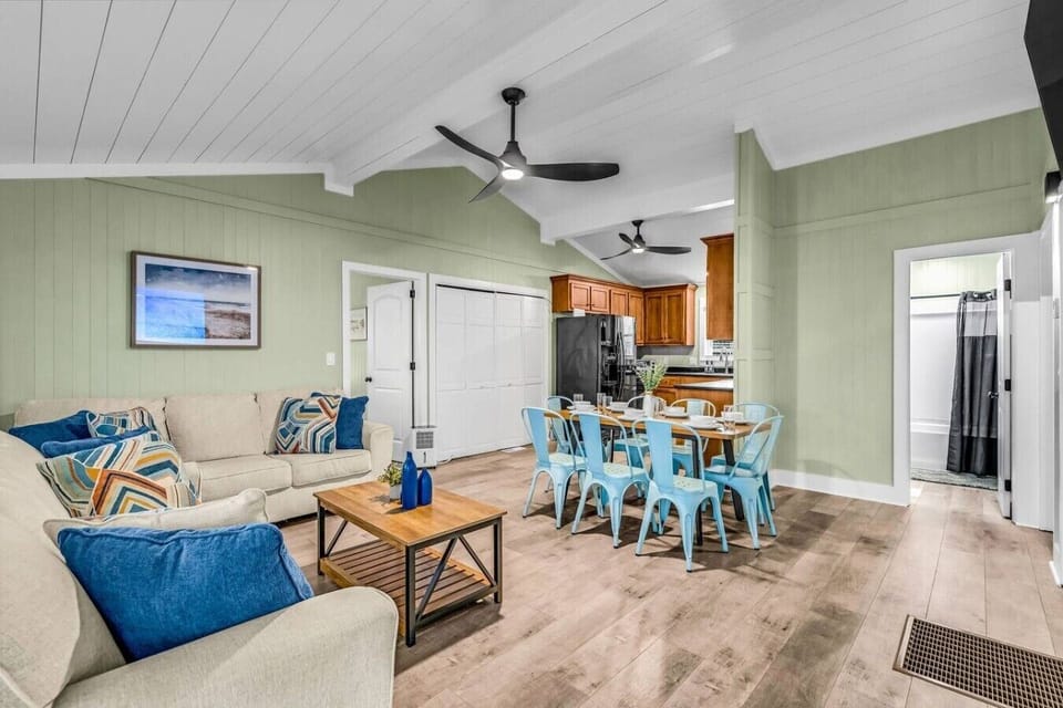 Ceiling fans hum overhead as the whole group spreads out in this breezy open living area.