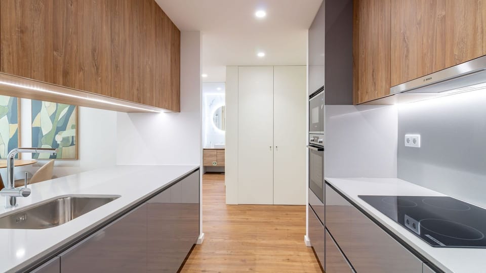 Discover the joy of home cooking in this well-appointed galley kitchen, equipped with modern appliances to make meal preparation a breeze. From a quick coffee to a gourmet dinner, everything you need is here for a delightful culinary experience. #GalleyKi