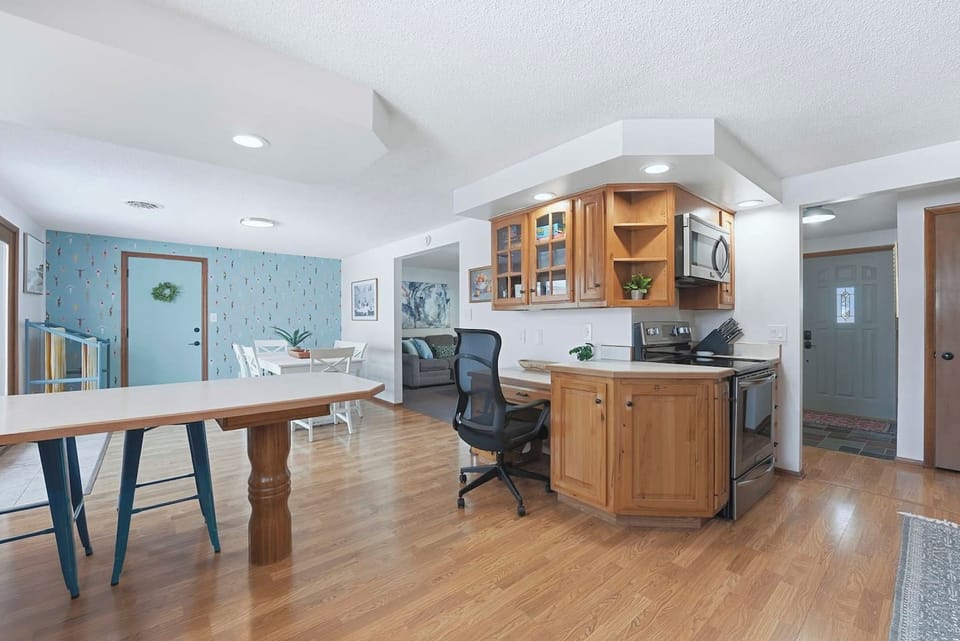 Catch up on emails at the built in desk before whipping up brunch at the kitchen island, keeping you right in the center of the action in this open Fort Wayne home.