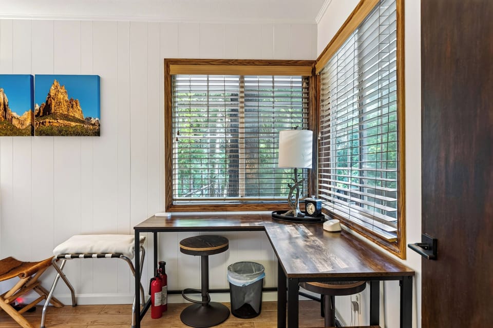 Dedicated workspace with peaceful forest views.