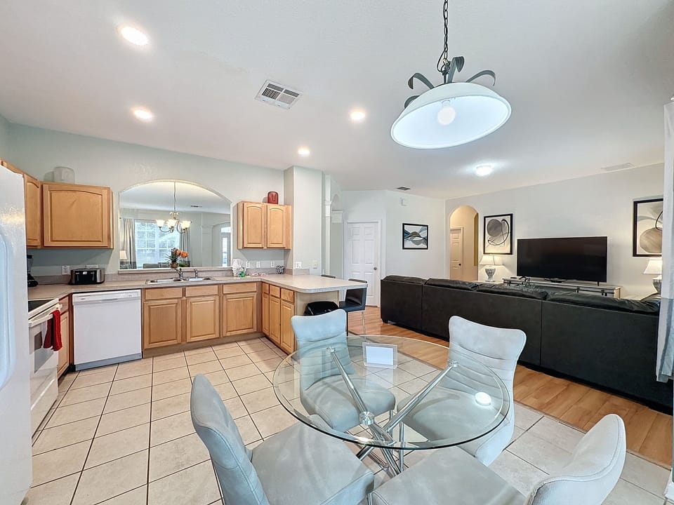 Large, open concept kitchen and living areas with multiple seating options. The perfect space for family dinners and evening entertainment!