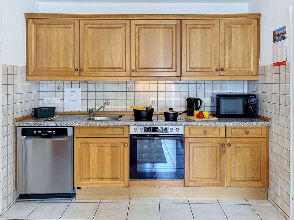 Kitchen, Kitchen Appliance, Countertop, Major Appliance, Cabinetry, Wood, Flooring, Interior Design, Kitchen Sink, Sink