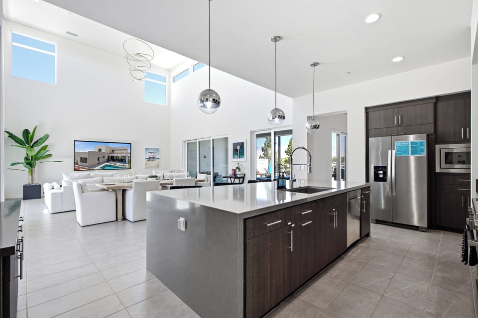 The kitchen, dining room, and living room flow together as one.