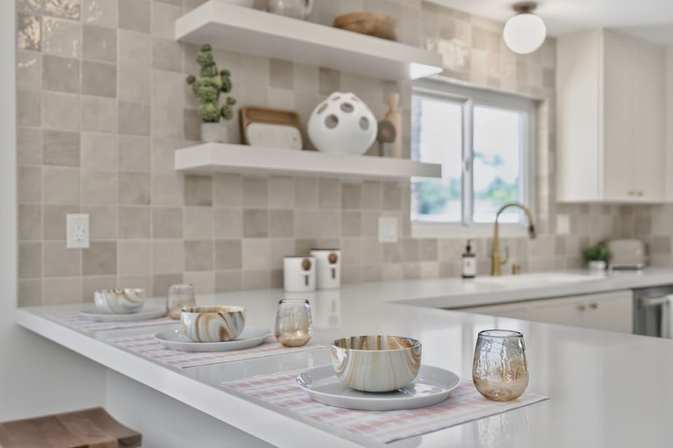 Kitchen peninsula with counter seating, perfect for casual breakfasts, morning coffee, or keeping the cook company.
