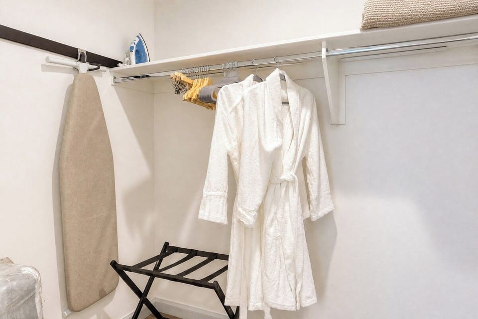 Everything you need for a comfortable stay—plush robes, an iron for crisp outfits, and hangers to keep your wardrobe organized.
