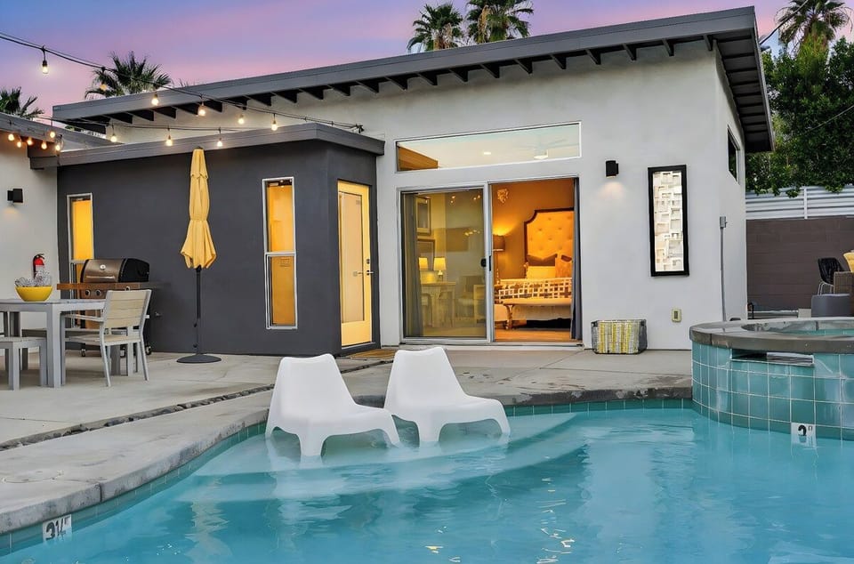 Slip into your private pool ledge loungers as twilight sets the perfect mood for an unforgettable evening retreat.