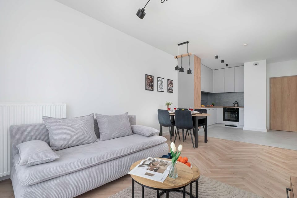 Relax in the stylish living room with a comfortable sofa and modern decor.