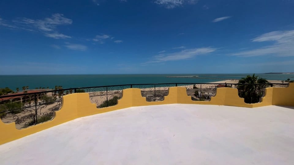 A wide-open rooftop terrace offering an ideal blank canvas for lounging, dining, or taking in ocean views.