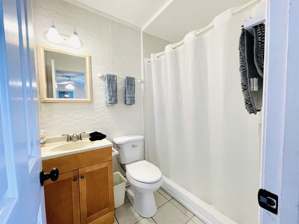 Rinse off the sand and salt in this sparkling clean, spa-inspired bathroom.

