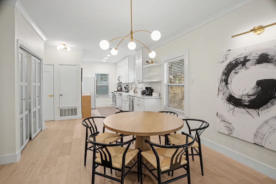 Bright modern dining area with stylish kitchen and seating for four