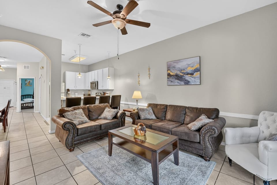 Relax and recharge in the condo's comfortable living room after a day of Orlando adventures.