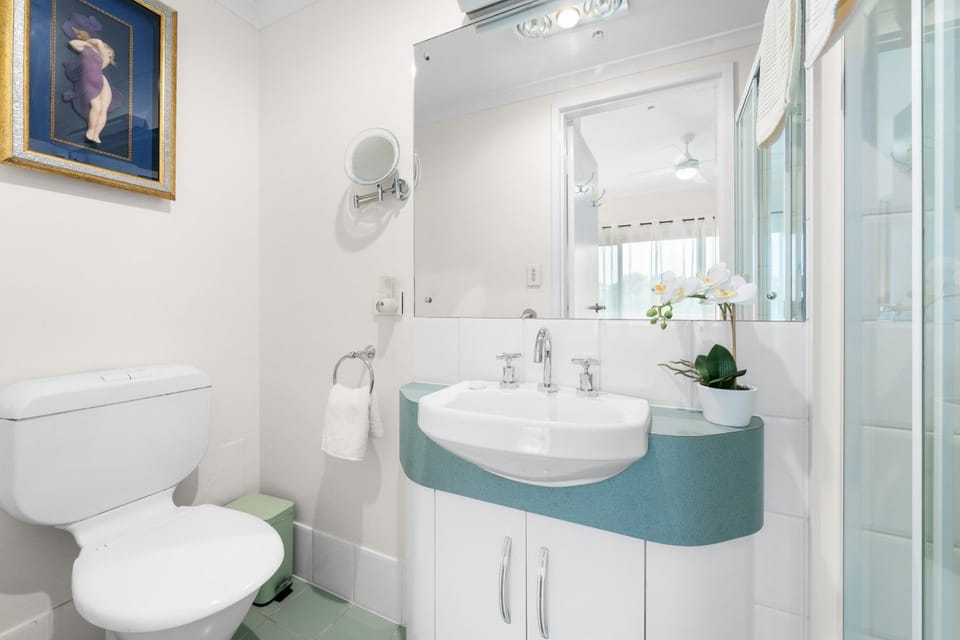 Clean, well-appointed bathroom with vanity and shower