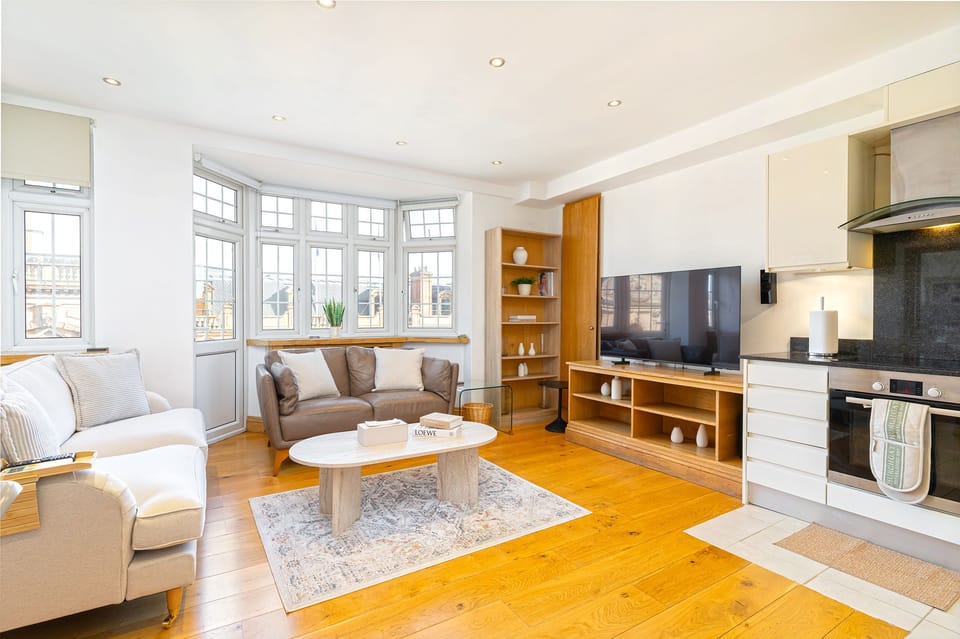 A cozy living room featuring a balcony door, perfect for relaxing and enjoying outdoor views.