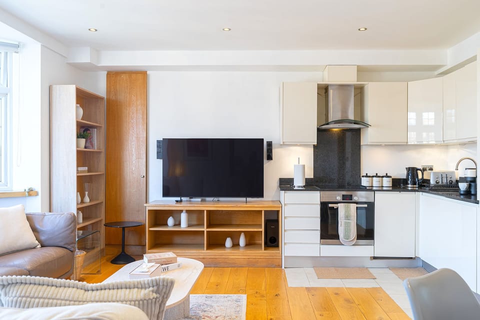 Living room and fully equipped kitchen perfect for relaxing and entertaining.
