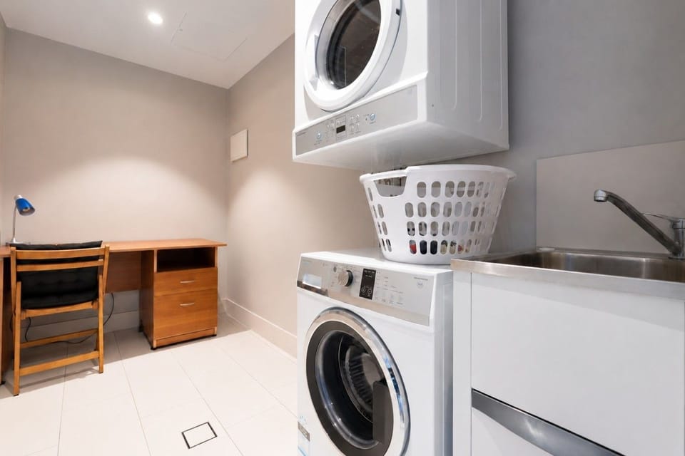 A neat and convenient laundry area with modern appliances, making it easy to take care of your washing throughout your stay.
