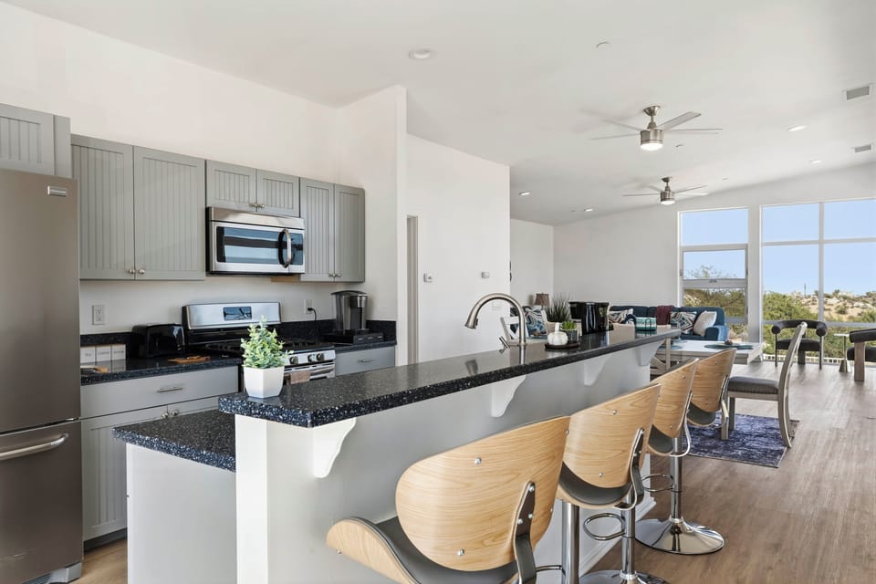 Pull up a seat at the kitchen bar for coffee, conversation, or a casual bite before heading out for the day.