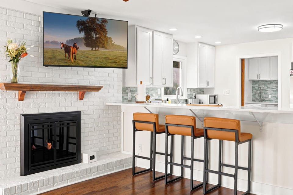 Kitchen 1: This bright and thoughtfully arranged kitchen offers plenty of counter space, convenient appliances, and a comfortable setting for everything from coffee to full meals.