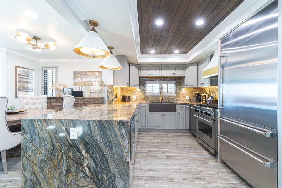 Fully equipped kitchen with generous prep space and gourmet Viking stainless steel appliances.
                