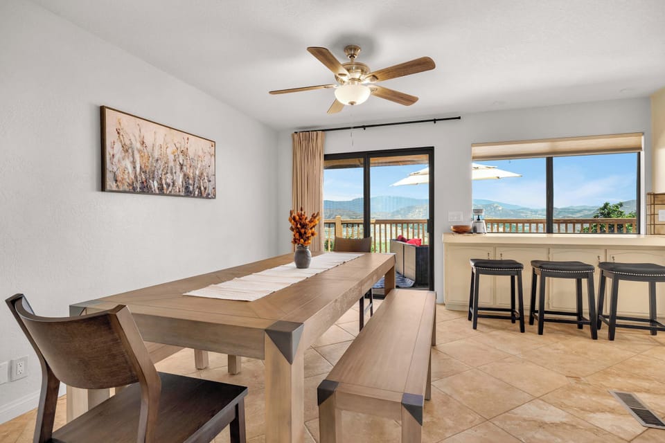 Bright dining space with a convenient breakfast bar and ample seating