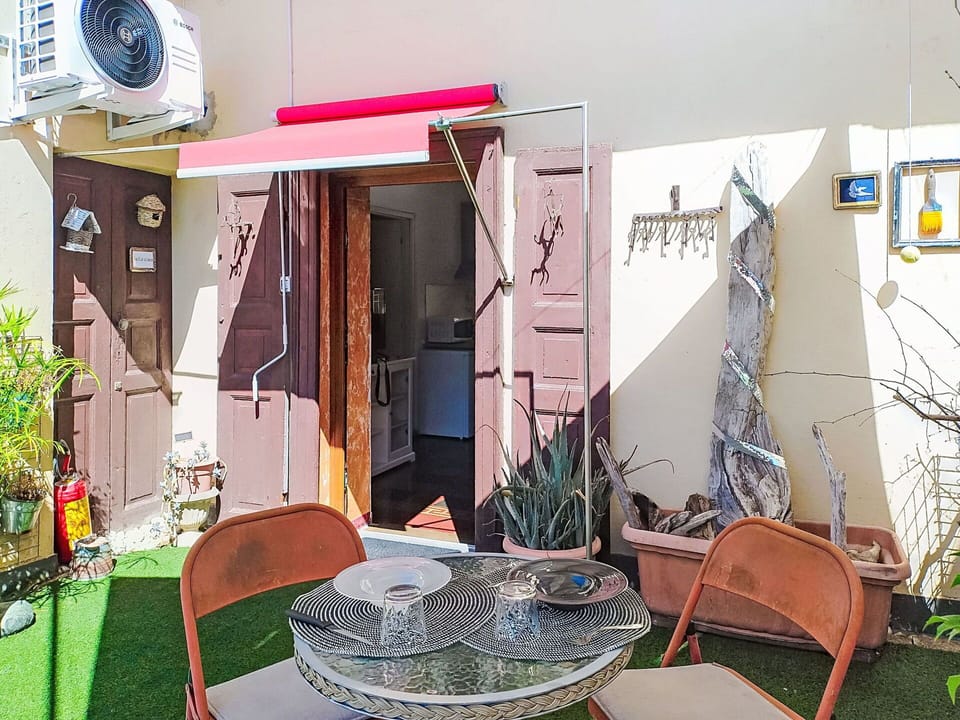 Flowerpot, Furniture, Floor, Chair, Houseplant, Shade, Wood Stain, Outdoor Furniture, Courtyard, Outdoor Table