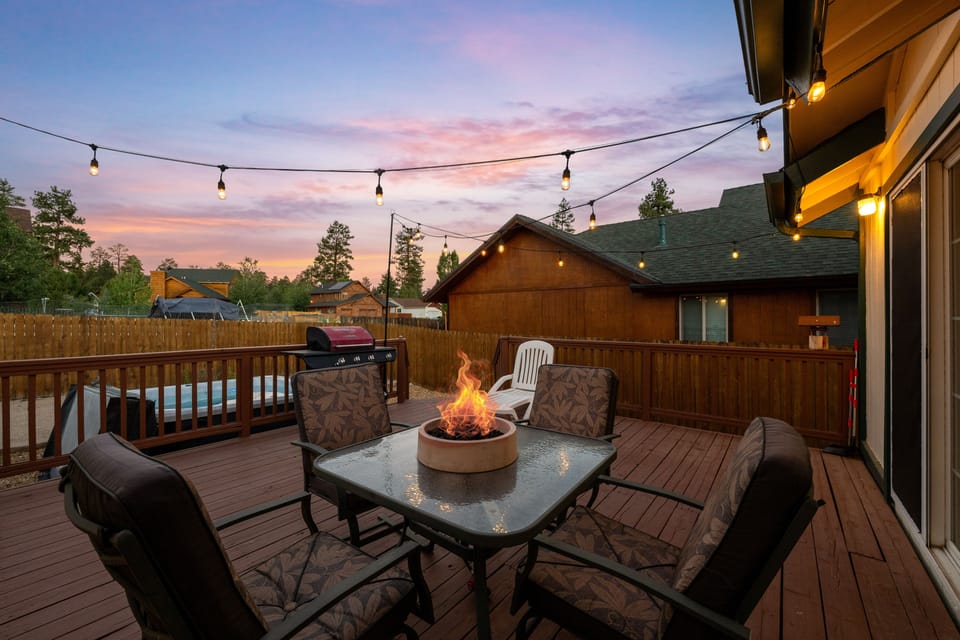 Back Deck - Private Hot Tub in backyard with string lights and gas fire pit.