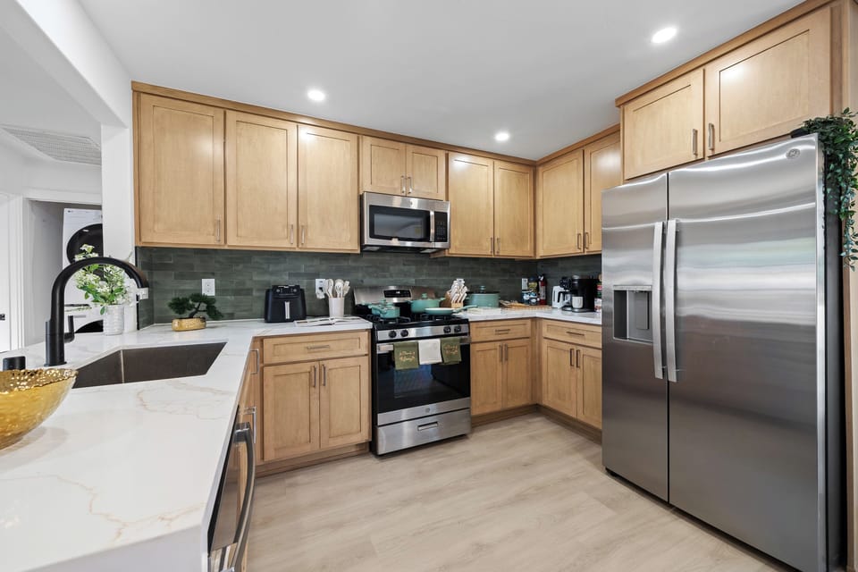 Spacious kitchen with wood cabinets and plenty of room for meal prep