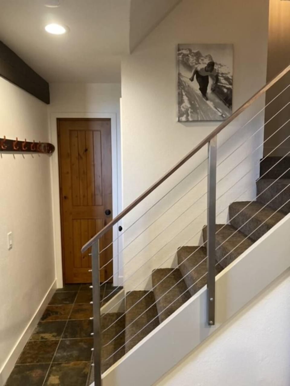 Entry way with storage and guest bath. 