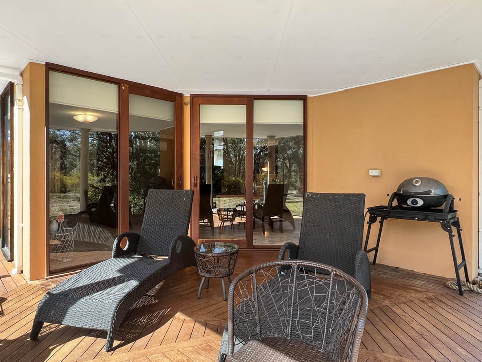 Charming alfresco space, ideal for outdoor dining and relaxation.
