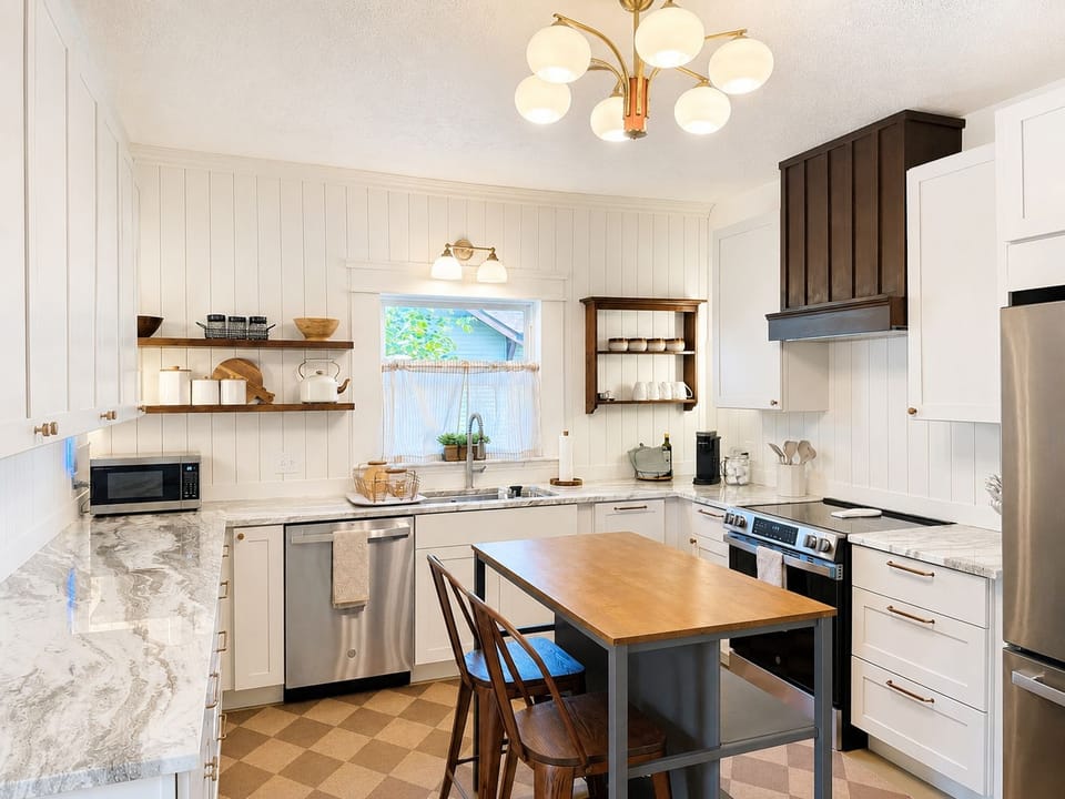 Bright modern kitchen with island seating and stylish farmhouse touches