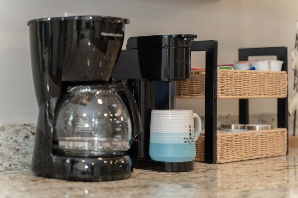 The coffee bar covers every kind of coffee drinker — drip pot and Keurig, with coffee and K-pods provided for your stay.
