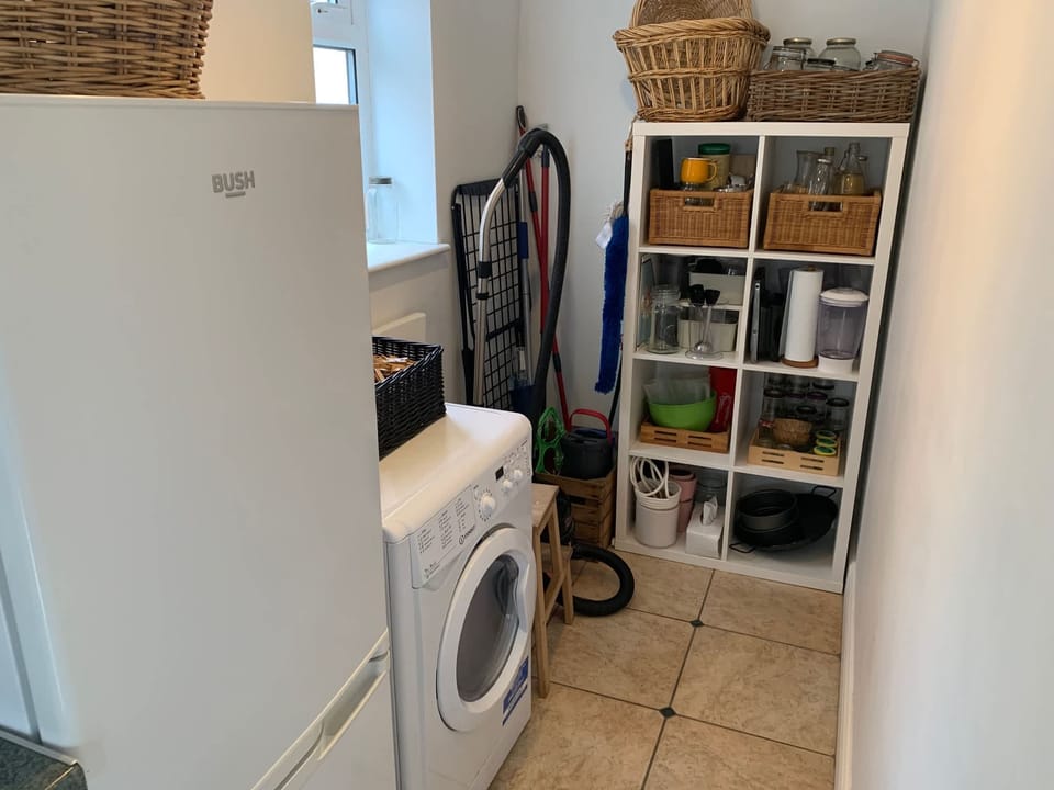 Utility area in kitchen with washer dryer
