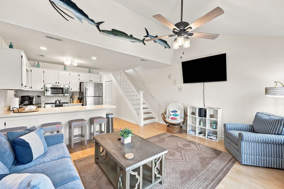 Unwind after a day in the sun with plenty of seating, beach-inspired decor, and a smart TV.