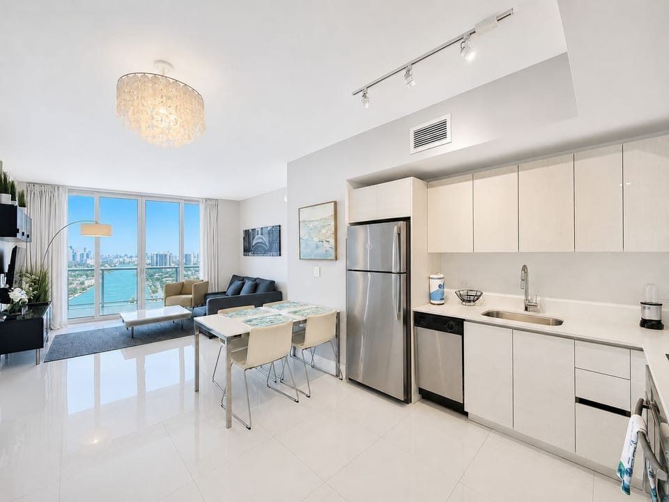 Bright modern condo with sleek kitchen and stunning water views