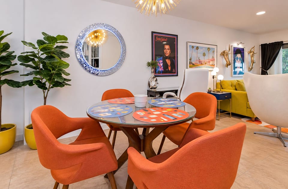 Retro round table styled with mirror & greenery