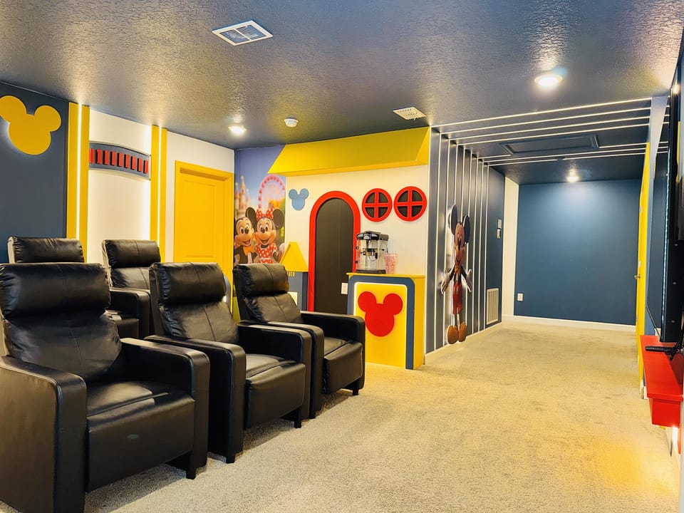 Fun retro video-game themed entertainment room with colorful custom décor.