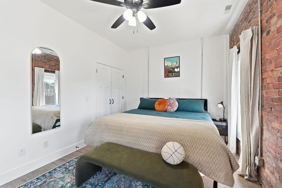 Spacious king bedroom with quiet street views and plush bedding. Relax in comfort close to games at Parkview Field.