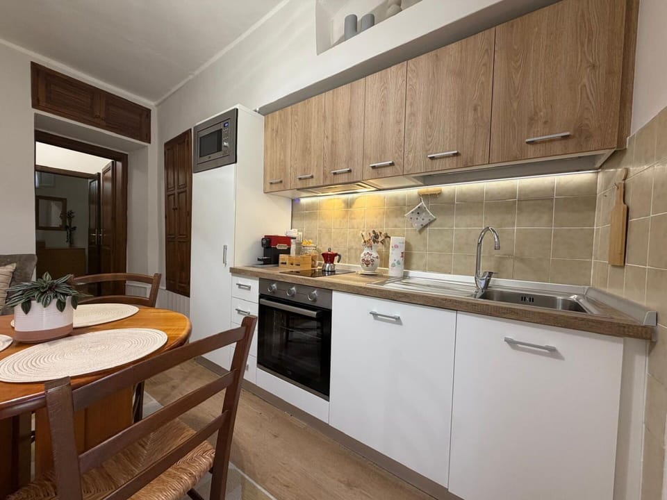 Countertop, Kitchen Appliance, Major Appliance, Kitchen, Interior Design, Furniture, Flooring, Wood, Cabinetry, Floor