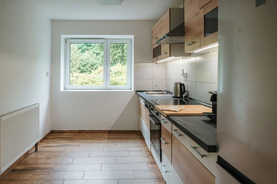 Bright modern kitchen with natural light and sleek finishes