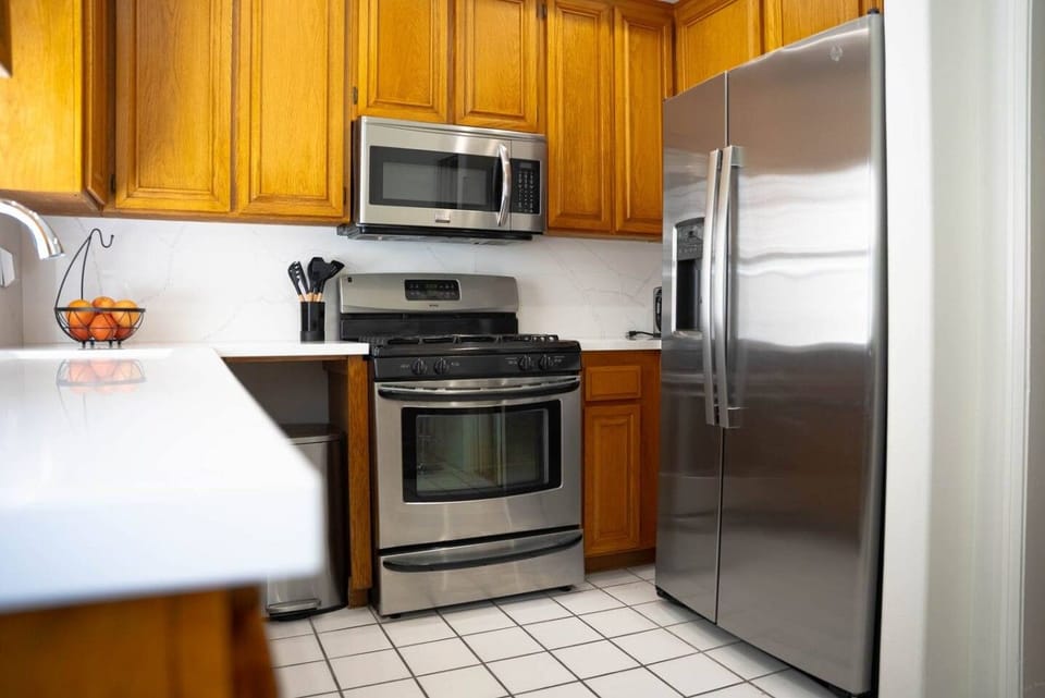 Five-burner gas range and full-size oven, ready for real cooking, not just reheating