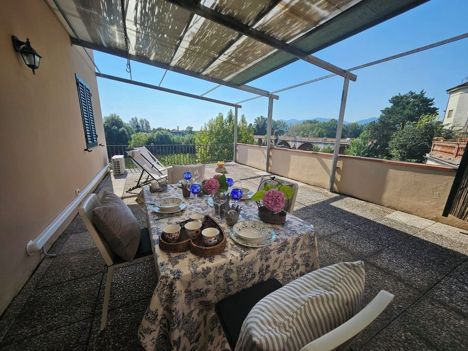 Furniture, Chair, Outdoor Furniture, Shade, Outdoor Table, Balcony, Kitchen & Dining Room Table, Houseplant, Outdoor Structure, Backyard