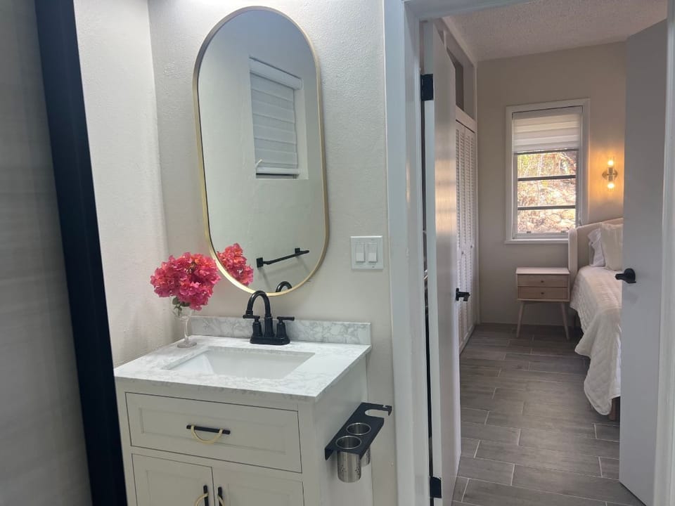 Jack & Jill bathroom. Accessible from bedroom & living area