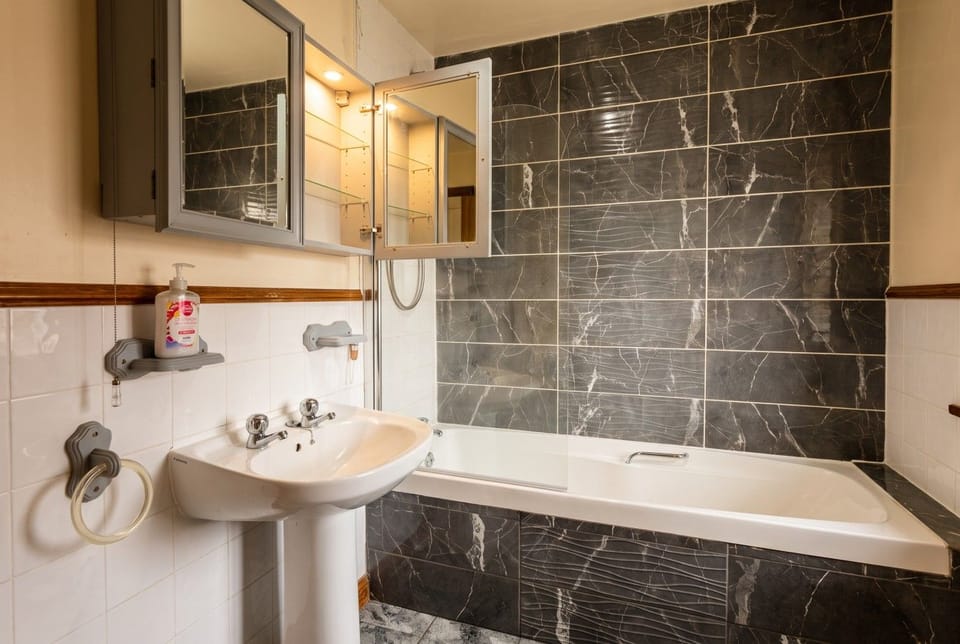 This double sits under a sloped ceiling with a window to the garden.