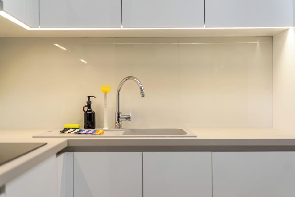 Bright bathroom with illuminated mirror