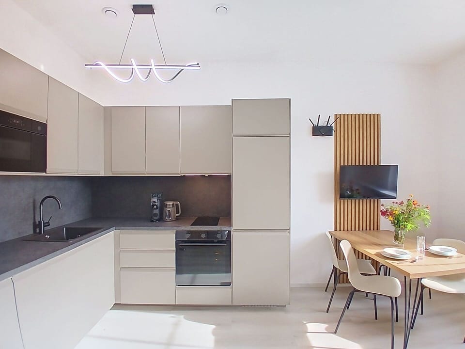Furniture, Kitchen, Interior Design, Flooring, Countertop, Kitchen Appliance, Cabinetry, Wood, Floor, Light Fixture
