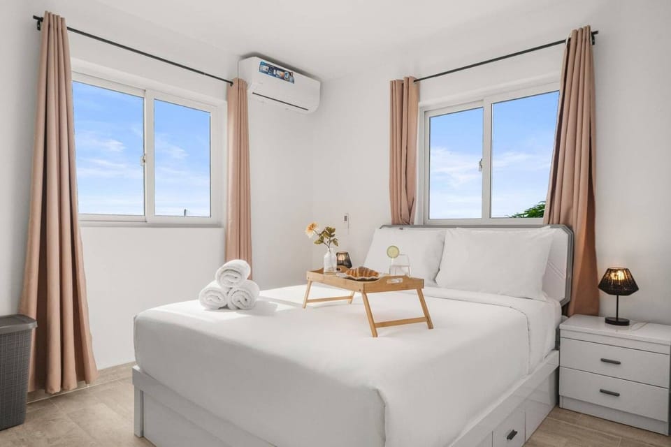 Wake up to soft natural light in this bright bedroom, where serene views and a peaceful atmosphere create an easy start to the day
