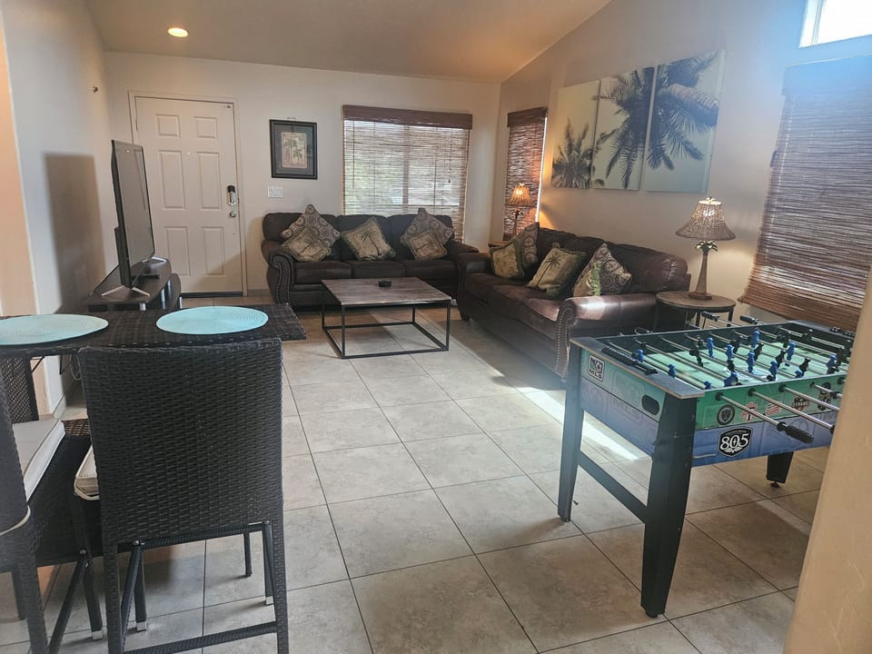 Spacious living room with foosball and plenty of room to gather.