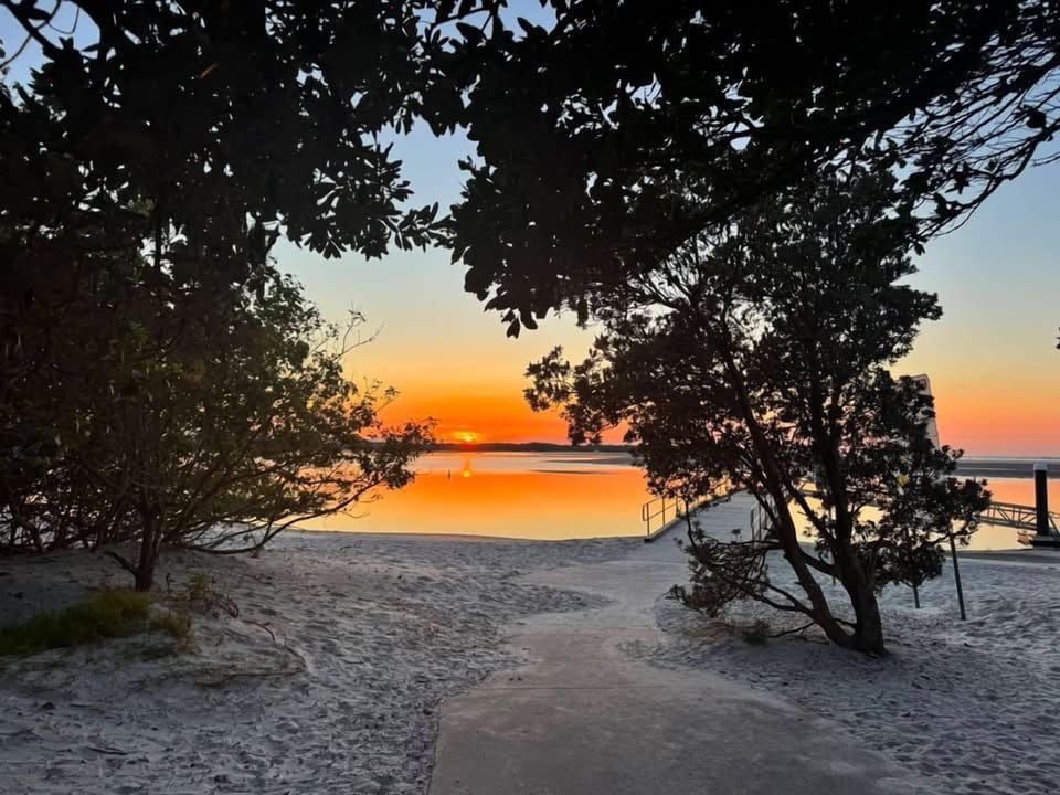 Golden Beach evenings are something special – wander down to the foreshore and watch the colours change over the calm waters of the Passage.
