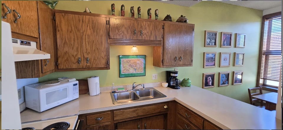 A cozy studio suite featuring two comfortable queen beds, perfect for a restful stay.